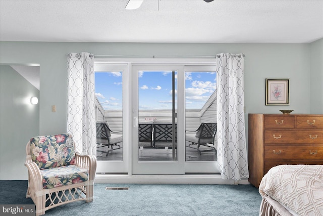 5401 Coastal Hwy Unit 306, Ocean City, MD 21842 - bedroom featuring visible vents, a ceiling fan, a textured ceiling, carpet floors, and access to outside