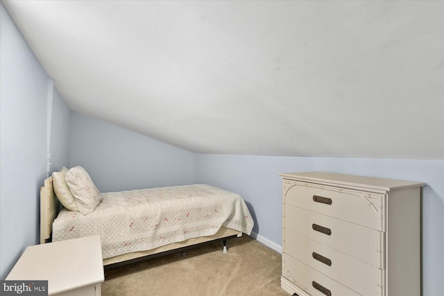 5401 Coastal Hwy Unit 306, Ocean City, MD 21842 - bedroom featuring baseboards, lofted ceiling, and carpet floors