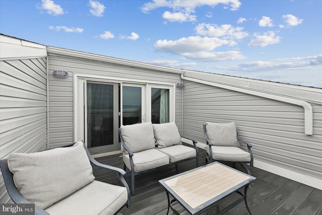 5401 Coastal Hwy Unit 306, Ocean City, MD 21842 - wooden deck featuring outdoor lounge area