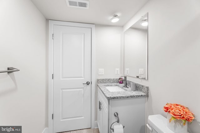 12435 Sea Oaks Ln Unit 3, Berlin, MD 21811 - half bathroom with visible vents, toilet, and vanity