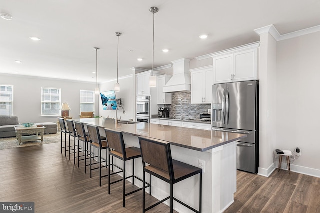 12435 Sea Oaks Ln Unit 3, Berlin, MD 21811 - kitchen with custom range hood, stainless steel fridge, white cabinetry, a spacious island, and a sink