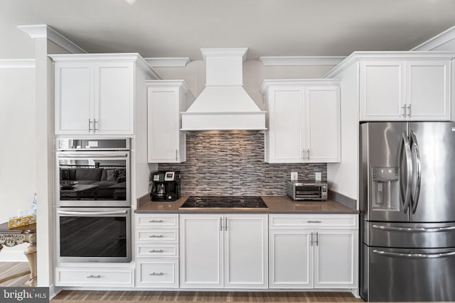 12435 Sea Oaks Ln Unit 3, Berlin, MD 21811 - kitchen featuring decorative backsplash, appliances with stainless steel finishes, custom range hood, and dark countertops