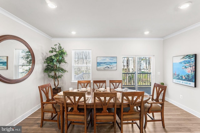12435 Sea Oaks Ln Unit 3, Berlin, MD 21811 - dining room featuring baseboards, ornamental molding, and a healthy amount of sunlight
