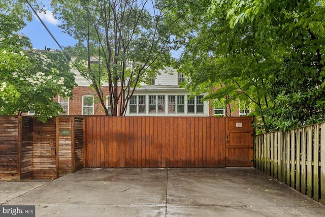 view of patio / terrace with fence and a gate