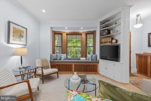 living room with crown molding, light wood-type flooring, built in features, recessed lighting, and baseboards