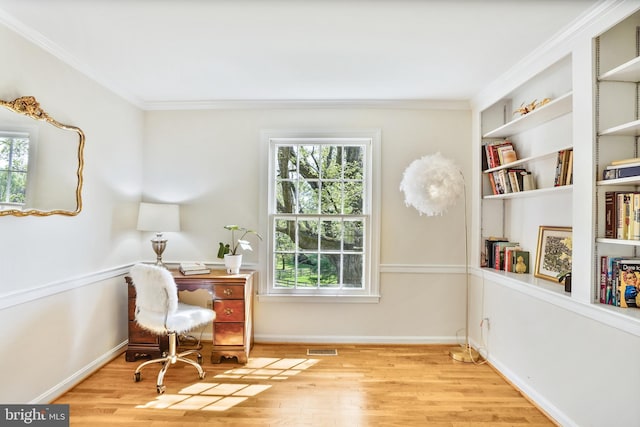 living area with a wealth of natural light, crown molding, and wood finished floors