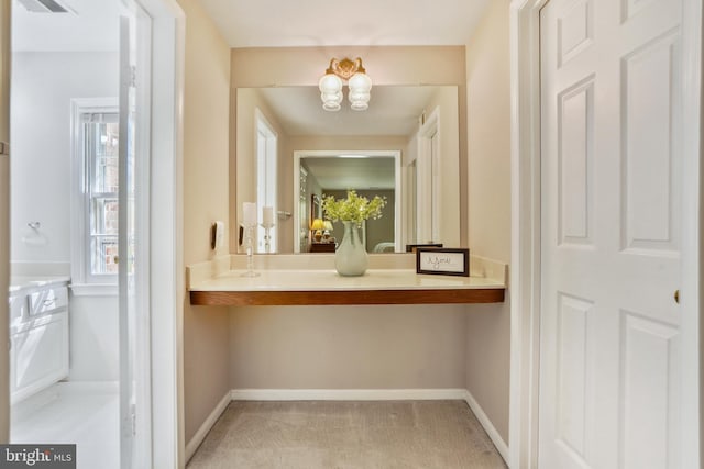 bathroom featuring visible vents, baseboards, and a chandelier