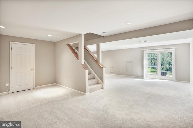 basement with stairs, baseboards, carpet, and recessed lighting