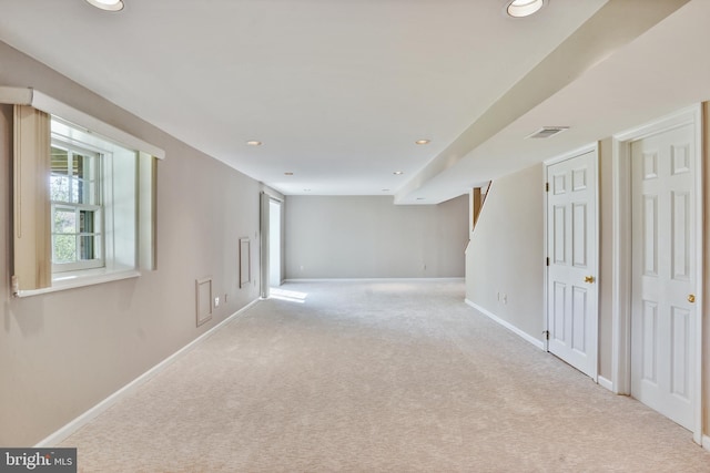 spare room featuring recessed lighting, visible vents, carpet flooring, and baseboards