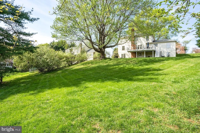 view of yard featuring a wooden deck