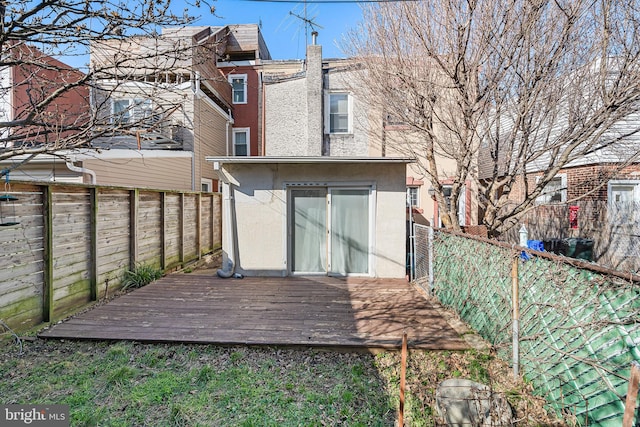 1529 E Berks St, Philadelphia, PA 19125 - rear view of property featuring a fenced backyard, stucco siding, and a deck