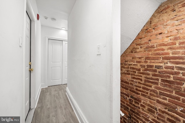 1529 E Berks St, Philadelphia, PA 19125 - corridor featuring brick wall, wood finished floors, and baseboards