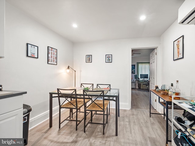 1529 E Berks St, Philadelphia, PA 19125 - dining room with baseboards, a ceiling fan, recessed lighting, light wood-style flooring, and a wall unit AC