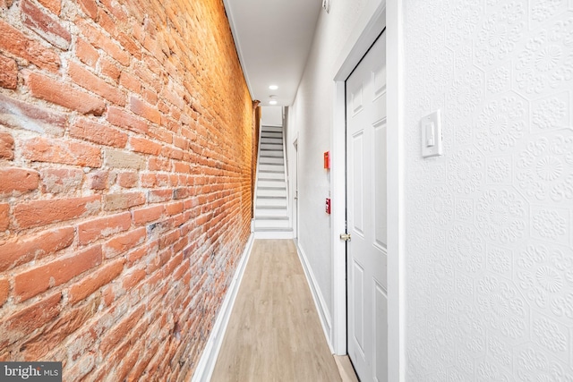 1529 E Berks St, Philadelphia, PA 19125 - hall featuring light wood-type flooring, brick wall, and baseboards