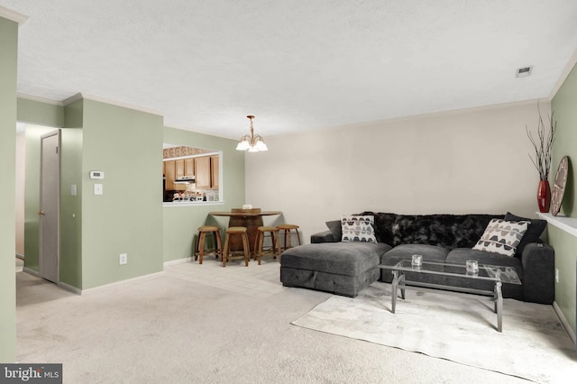 carpeted living area with an inviting chandelier, baseboards, and visible vents