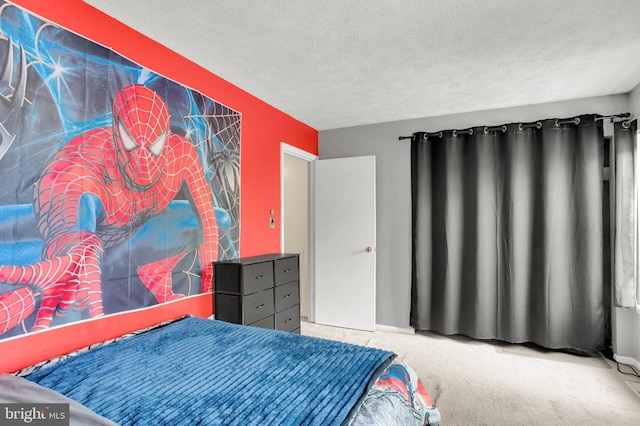 carpeted bedroom featuring a textured ceiling