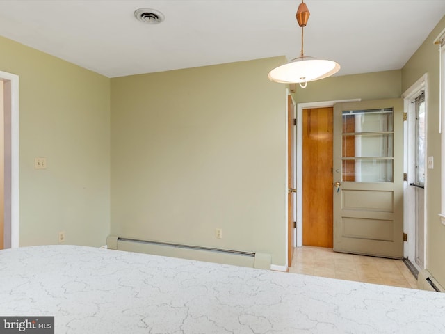 7147 Ohio Ave, Hanover, MD 21076 - unfurnished bedroom with a baseboard radiator, a baseboard heating unit, tile patterned flooring, and visible vents