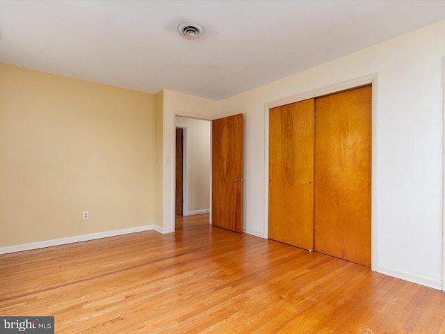 7147 Ohio Ave, Hanover, MD 21076 - unfurnished bedroom featuring light wood-style floors, visible vents, baseboards, and a closet