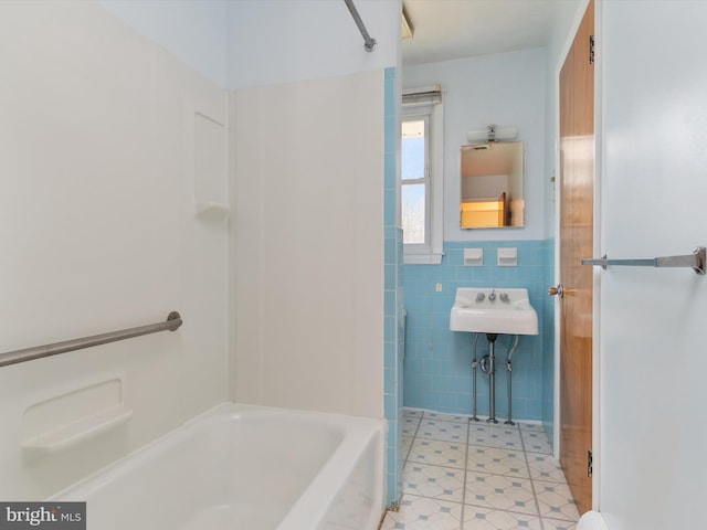 7147 Ohio Ave, Hanover, MD 21076 - full bath with a sink,  shower combination, and tile walls