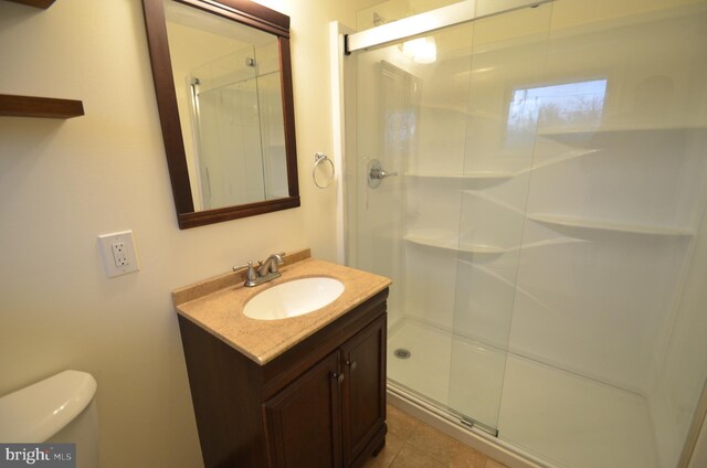 49 Wallace Rd, Princeton Junction, NJ 08550 - full bath featuring a shower stall, vanity, tile patterned flooring, and toilet