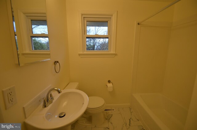 49 Wallace Rd, Princeton Junction, NJ 08550 - bathroom with a sink, baseboards, marble finish floor, and a healthy amount of sunlight