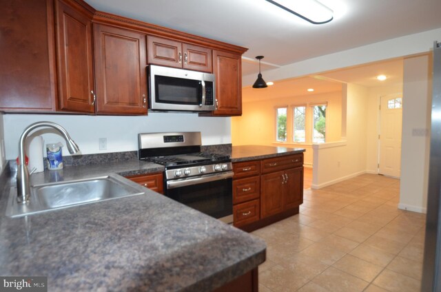 49 Wallace Rd, Princeton Junction, NJ 08550 - kitchen featuring dark countertops, baseboards, a sink, and appliances with stainless steel finishes