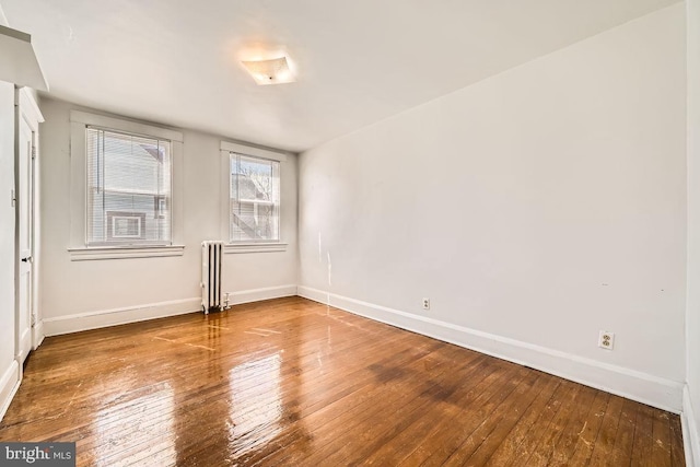 1233 Kahler Ave, Rosedale, MD 21237 - spare room featuring wood-type flooring, radiator heating unit, and baseboards