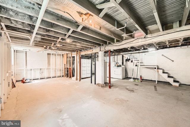 1233 Kahler Ave, Rosedale, MD 21237 - unfinished basement featuring stairway and independent washer and dryer