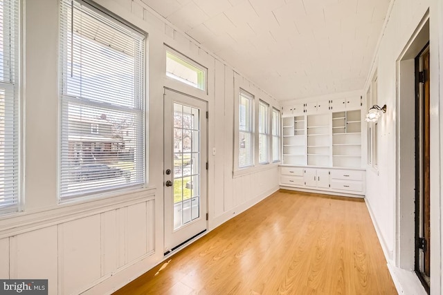 1233 Kahler Ave, Rosedale, MD 21237 - interior space with light wood-type flooring, a decorative wall, and built in shelves