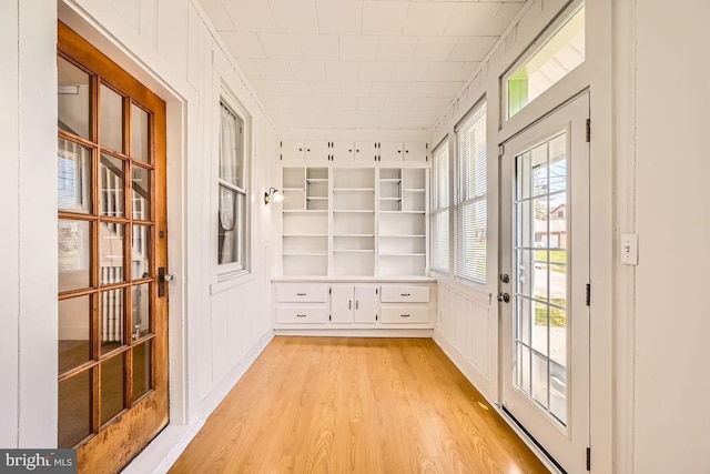 1233 Kahler Ave, Rosedale, MD 21237 - doorway to outside featuring light wood-type flooring and built in features