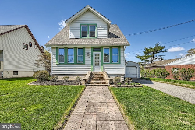 1233 Kahler Ave, Rosedale, MD 21237 - bungalow with a detached garage, an outdoor structure, a front lawn, a shingled roof, and driveway