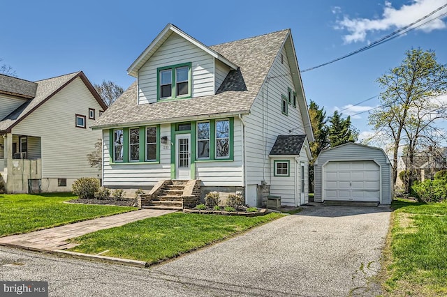 1233 Kahler Ave, Rosedale, MD 21237 - view of front of home featuring aphalt driveway, a garage, an outdoor structure, a front yard, and a shingled roof