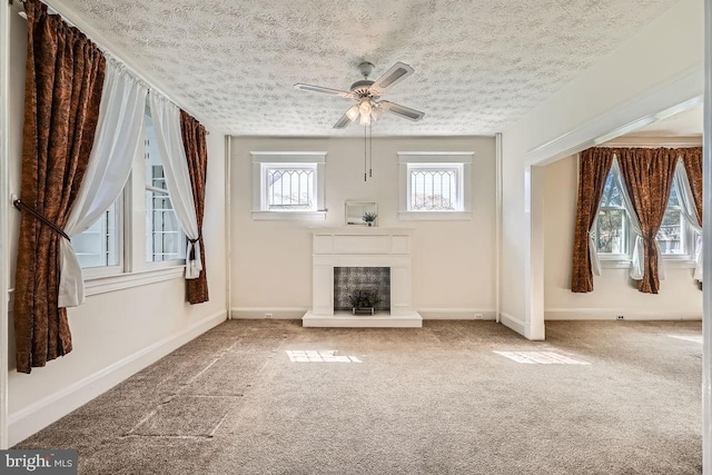 1233 Kahler Ave, Rosedale, MD 21237 - unfurnished living room with a fireplace with raised hearth, baseboards, a ceiling fan, and carpet flooring