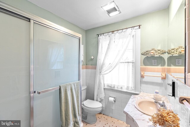 28 Ambler Rd, Cherry Hill, NJ 08002 - bathroom featuring tile walls, vanity, toilet, a stall shower, and tile patterned flooring