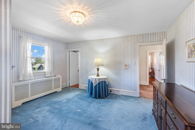 28 Ambler Rd, Cherry Hill, NJ 08002 - unfurnished bedroom featuring radiator, carpet flooring, a notable chandelier, baseboards, and wallpapered walls