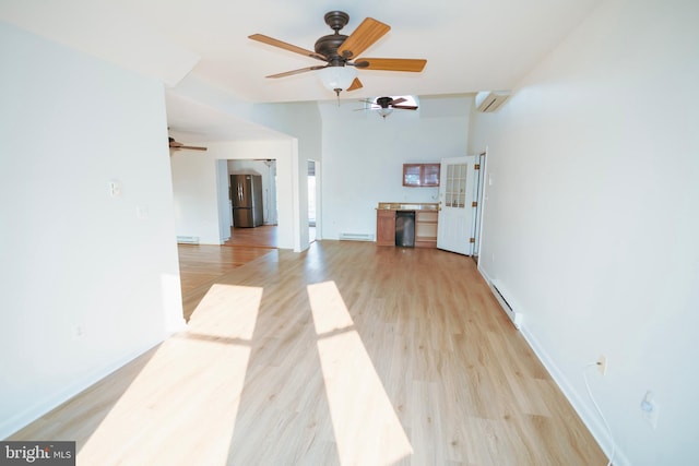 4513 Baker Valley Rd, Frederick, MD 21704 - unfurnished living room featuring a baseboard heating unit, ceiling fan, an AC wall unit, light wood-style flooring, and baseboard heating