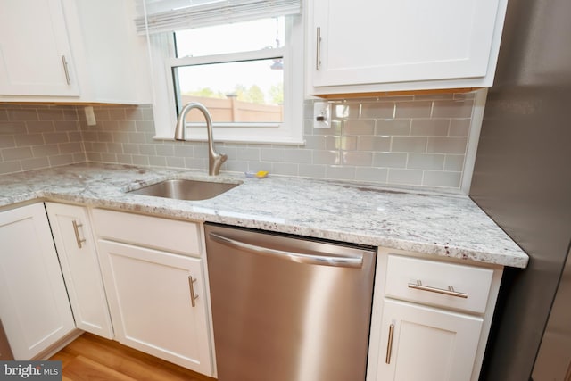 4513 Baker Valley Rd, Frederick, MD 21704 - kitchen with stainless steel appliances, a sink, white cabinetry, and backsplash
