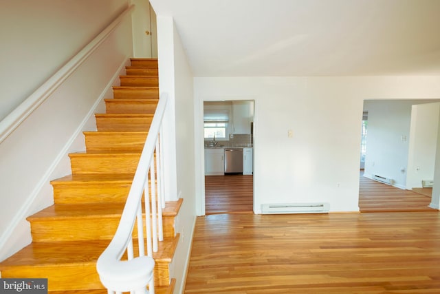 4513 Baker Valley Rd, Frederick, MD 21704 - stairs featuring a baseboard radiator and wood finished floors