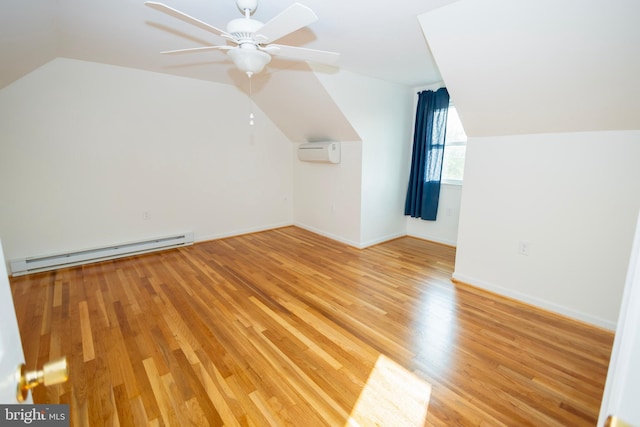 4513 Baker Valley Rd, Frederick, MD 21704 - bonus room featuring a baseboard heating unit, vaulted ceiling, light wood-style floors, a wall mounted air conditioner, and ceiling fan