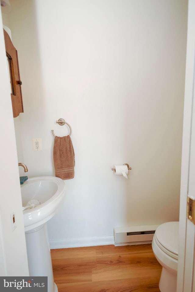 4513 Baker Valley Rd, Frederick, MD 21704 - bathroom featuring a baseboard heating unit, wood finished floors, toilet, and baseboards