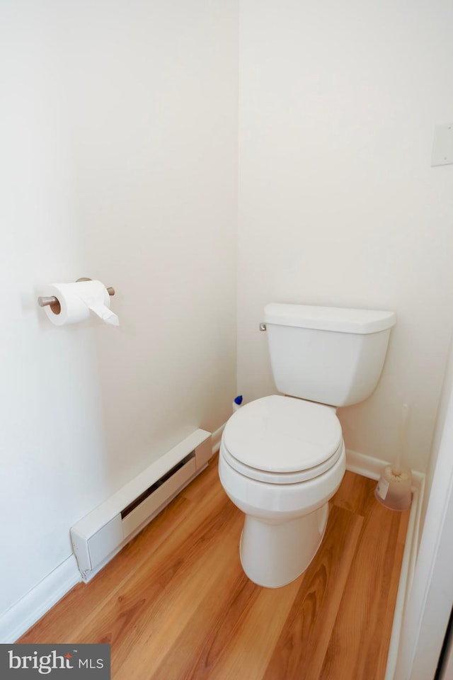 4513 Baker Valley Rd, Frederick, MD 21704 - bathroom featuring a baseboard radiator, wood finished floors, toilet, and baseboards