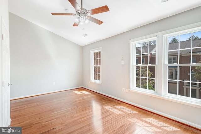 4024 Werthers Ct, Fairfax, VA 22030 - empty room with baseboards, a healthy amount of sunlight, vaulted ceiling, and light wood finished floors
