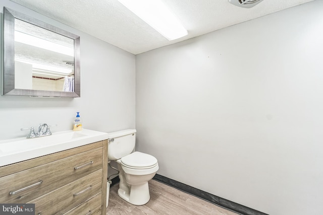 8549 Marybeth Way, Ellicott City, MD 21043 - bathroom featuring toilet, baseboards, wood finished floors, and vanity