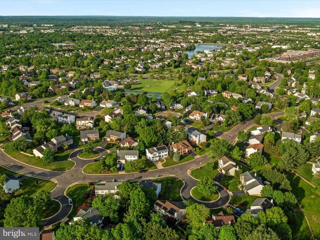 birds eye view of property with a water view and a residential view