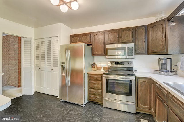 kitchen featuring light countertops and stainless steel appliances