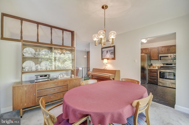 dining area with baseboards, a chandelier, and light carpet
