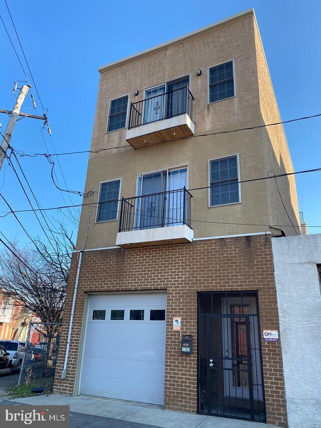 view of building exterior with an attached garage