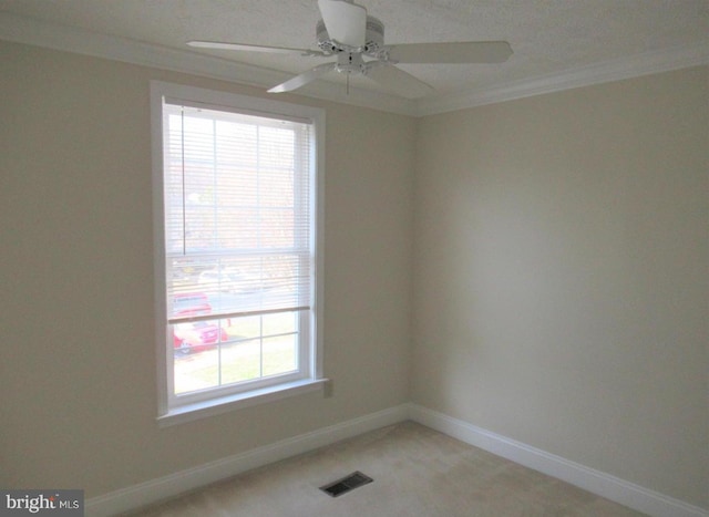 empty room with plenty of natural light, visible vents, baseboards, and ceiling fan