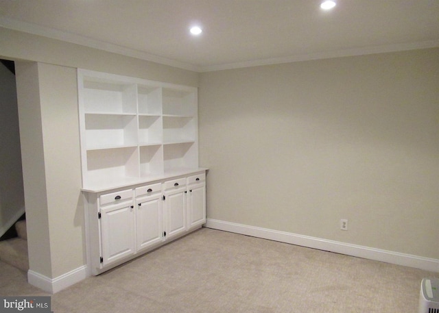 interior space with recessed lighting, light carpet, baseboards, and ornamental molding
