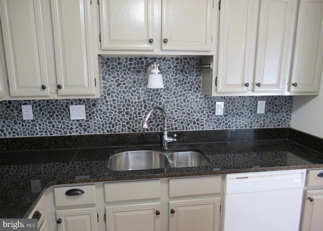 kitchen with decorative backsplash, white dishwasher, a sink, and white cabinets